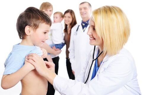 the doctor examines the child who has worms